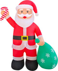 Giant Santa inflatable holding a candy cane and a green snowflake gift sack