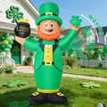 Leprechaun inflatable in a green hat holding a pot of gold and waving a shamrock in a front yard