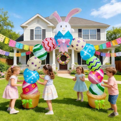 Easter arch inflatable of stacked colorful eggs with a bunny on top and children playing on a lawn