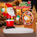 Santa inflatable next to a rotating reindeer target wheel with a Merry Christmas sign on a porch