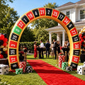Roulette wheel inflatable arch over a red carpet at an outdoor casino party